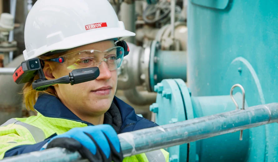 An employee using smart glasses in an industrial estate 