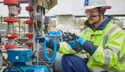 An employee carrying out condition monitoring work
